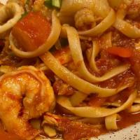 Seafood Fra Diavolo · Shrimp, Scallops, Crawfish & Calamari Tossed with fettuccine  in Spicy Marinara.