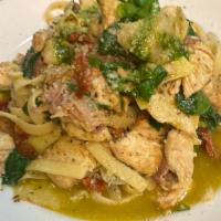 Chicken Syracusa · Chicken, Spinach, Prosciutto, Artichokes, Sun-Dried Tomato, Fettuccine, and Pesto.
