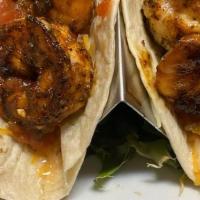 Blackened Shrimp Tacos · blackened Shrimp served with shredded mexican cheese and salsa picante!