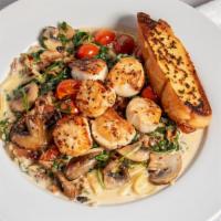 Scallop Pasta · Seared sea scallops with bacon, mushrooms, cherry tomatoes and arugula served with linguine ...