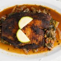 Fasika Fish · Fresh water tilapia seasoned  with herbs and spices ,and blackened on cast iron grill and se...