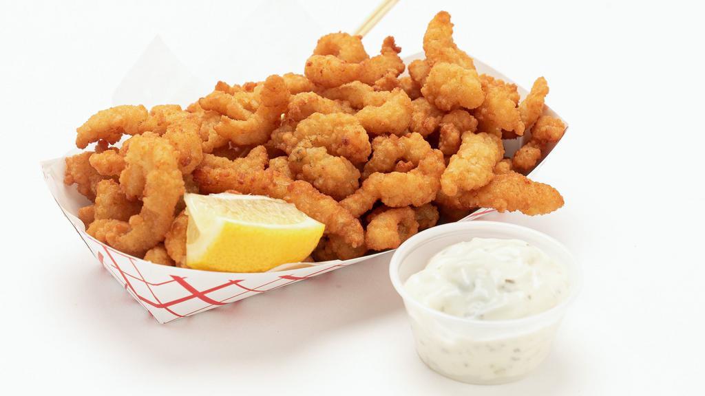 Fried Clam Strip · Premium juicy clam strips lightly battered and fried. Large size. Served with tartar sauce and lemon.