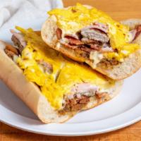 Porky Pig · Bacon, ham, scrapple and sausage with eggs and cheese on hoagie roll.