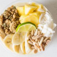 Cocolada · Blend of pineapple, banana, coconut milk, lime. Topped with granola, sliced almonds, banana,...