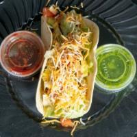 Steak Taco · Served with your choice of flour corn or crispy tortillas with lettuce cheese and pico de ga...