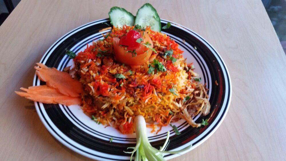 Vegetable Biryani · Basmati rice cooked with seasonal vegetable and herbs served with raita