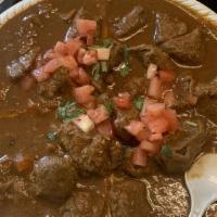 Lamb Roganjosh · Cubes of lamb cooked in a blended mixture of spices and curry sauce