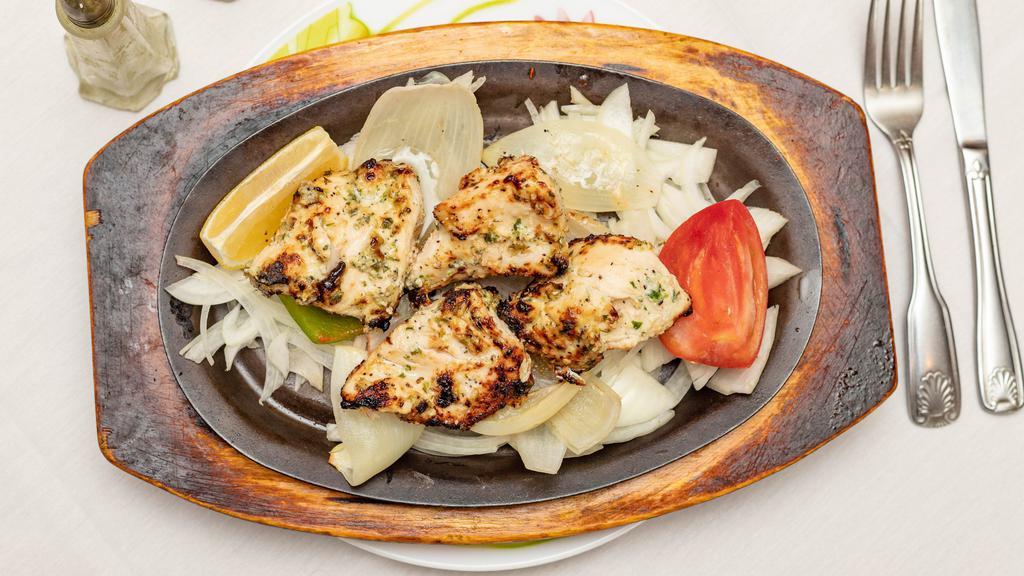 Chicken Sheesh Kabab · Chunks of boneless chicken breast marinated in yogurt and herbs,spice with tomato, onion and bell pepper,cooked in charcoal clay-oven.