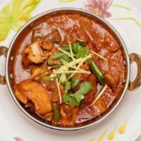 Chicken Karahi · Chunks Of Boneless Chicken Cooked in A Wok with Select Spices, Herbs, Fresh Tomatoes, Onions...