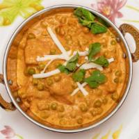 Matar Paneer · Homemade farmer's cheese cubes and green peas cooked in a creamy curry sauce.