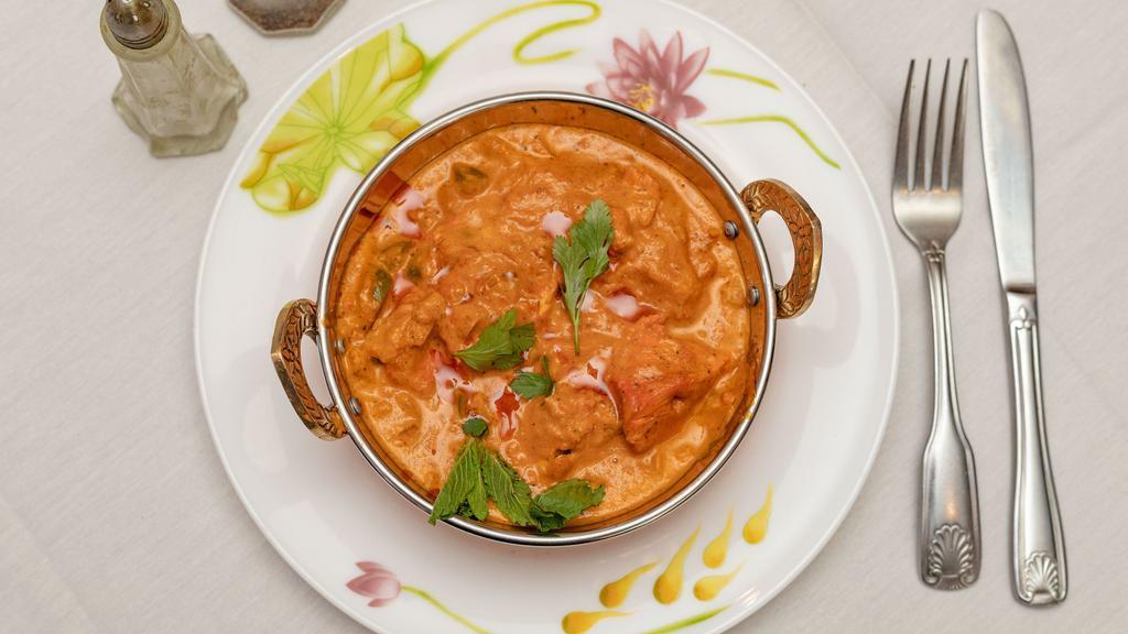 Chicken Tikka Masala · Boneless Chunk Chicken Cooked With A Fine Selection of Spice And Herbs With a Touch Of Yogurt.