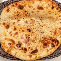 Garlic Naan · White Flour Bread Layered With Chopped Garlic Bread In A Flaming Charcoal Clay Oven.