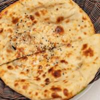 Naan · Baked In Our Clay Oven From enriched White Flour.