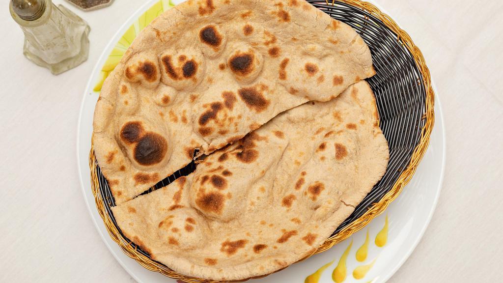 Roti · Made With Whole Wheat Flour Baked In Clay Oven.