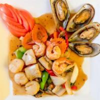 Seafood Madness · Very spicy. sautéed shrimp, squid, mussels, and scallops with onions, carrots, bell peppers,...