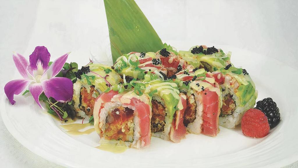 Crazy Roll (8 Pcs) · Spicy crunchy tuna and avocado inside, topped with black pepper tuna, scallion and tobiko in wasabi sauce.