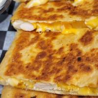 Cheese Quesadilla · Shredded cheddar jack cheese served with sour cream and salsa.