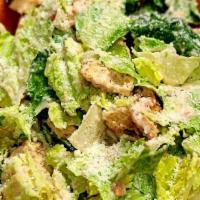 Caesar Salad · fresh romaine lettuce, homemade croutons, tossed in classic caesar dressing, & topped with g...