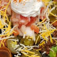 Taco Salad · Fresh romaine lettuce mixed with Big Vince's famous chili, diced tomatoes, black olives, and...