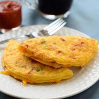 Western Omelets · A 4-pack of folded omelets featuring cheese, diced vegetables, and savory ham scrambled toge...