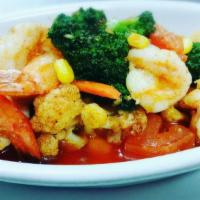 Shrimp Umburger · Sautéed shrimp with broccoli, cauliflower, corn, carrots and garlic in Neopolitan garlic sau...