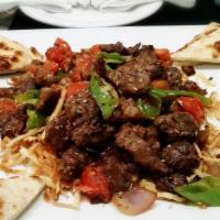 Çoban Kavurma · Sautéed, steel roasted lamb cubes with onions, green peppers, tomatoes, and oregano. Served ...