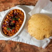 Chole Bhature · Deep fried puffed bread served with chickpeas curry. Vegetarian.