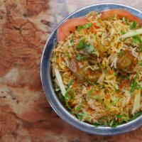 Goat Biryani · Saffron flavored basmati rice cooked with pieces of goat, over low fire with Indian herbs. S...