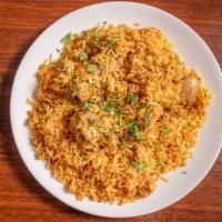 Chicken Biryani · Halal. Spiced chicken in delicious layers of long grain rice and nuts.