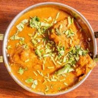 Navratan Korma · Mixed vegetable and nuts cooked in a creamy sauce.
