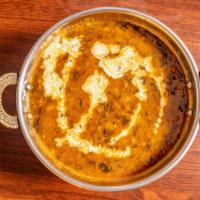 Dal Makhani · Black lentils cooked in Indian spices.