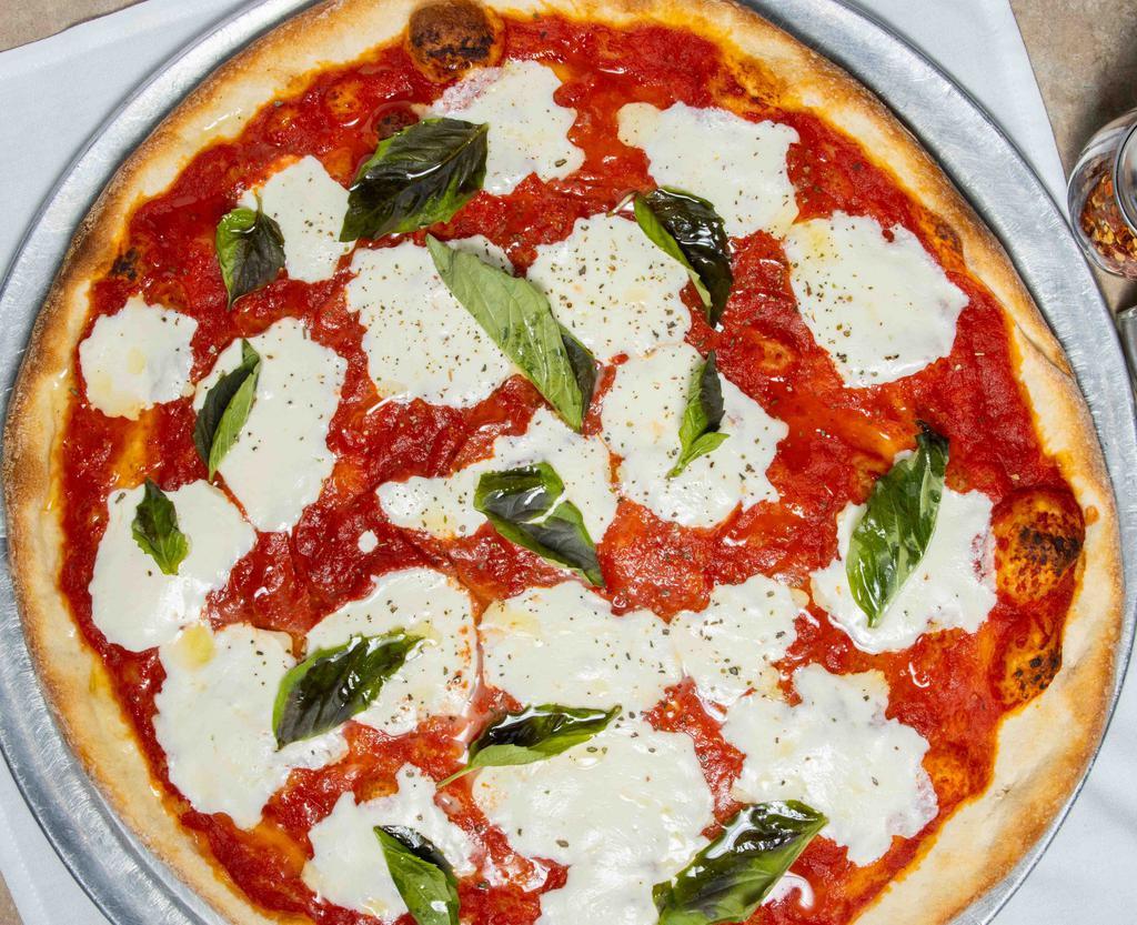 Margherita Pizza · Thin crust, tomato sauce, fresh mozzarella and basil.