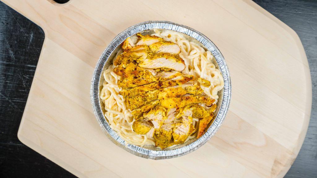 Chicken Alfredo Pasta · Grilled chicken tossed in creamy Alfredo sauce and spaghetti.