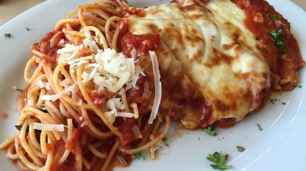 Chicken Parmesan · Breaded cutlet with tomato sauce, mozzarella cheese and spaghetti pasta.