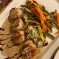 Pan Seared Scallops · Ginger beurre blanc, espresso reduction, over risotto, and vegetables.