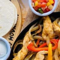 Grilled Chicken & Pepper Fajita · A classic Mexican dish with a Brazilian infusion of garlic paste and lime juice seared and c...