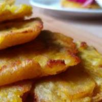 Bannann Peze With Pikliz · Double deep-fried plantain with spicy pickled slaw.