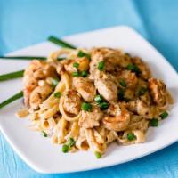 Cajun Chicken & Shrimp Fettuccine Alfredo · Spicy. Marinated chicken and shrimp mixed with a hint of Cajun seasoning topped over fettucc...