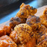 Tossed Popcorn Chicken · Our Signature Popcorn Chicken tossed in your choice of flavor!