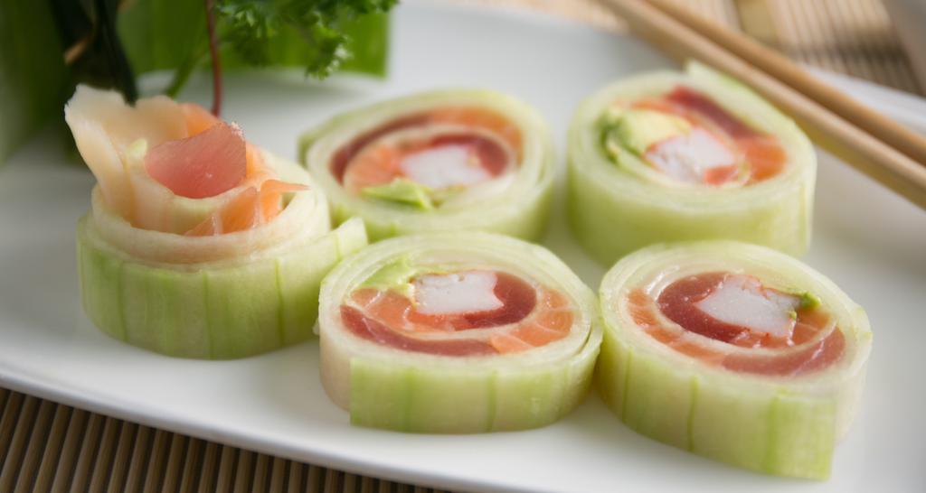 Seafood Naruto · Tuna, salmon, crabstick, tobiko and avocado rolled in thinly sliced cucumber.