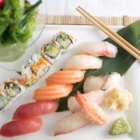 Sushi Deluxe · 10 pcs assorted nigiri sushi, 6 pcs california roll and seaweed salad