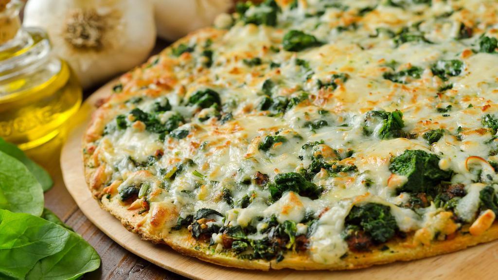 Spinach, Broccoli, Roasted Red Peppers & Feta Cheese Pizza · Our house made dough, made fresh daily topped with fresh spinach, broccoli, smoky roasted red peppers and tangy feta cheese, baked to perfection.
