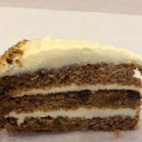 Carrot Cake · With real cream cheese, sliced walnuts and golden raisins