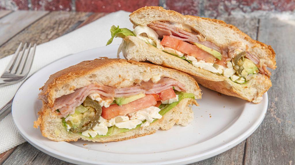 Tortas (Sandwiches) · With lettuce, tomatoes, avocado, cheese, beans, mayonnaise and your choice of meat.