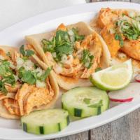 Tacos · Corn tortillas stuffed with your choice of meat garnished with chopped onions and cilantro. ...