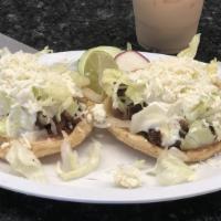 Sopes · Corn tortilla topped with green or red sauce and your choice of meat. Served with salad and ...