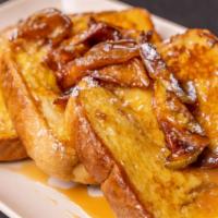 French Toast · Butter, Syrup, Powdered Sugar.