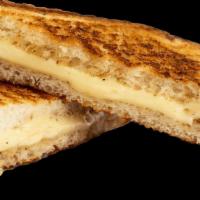Grilled Cheese · American cheese on white bread toasted on a panini press.