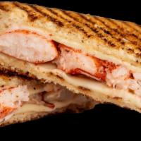 Lobster Grilled Cheese · American cheese on white bread toasted on a panini press with lobster mixed in.