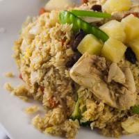 Pineapple Fried Rice · Fried rice with pineapple rice, raisins, egg and mixed vegetables.